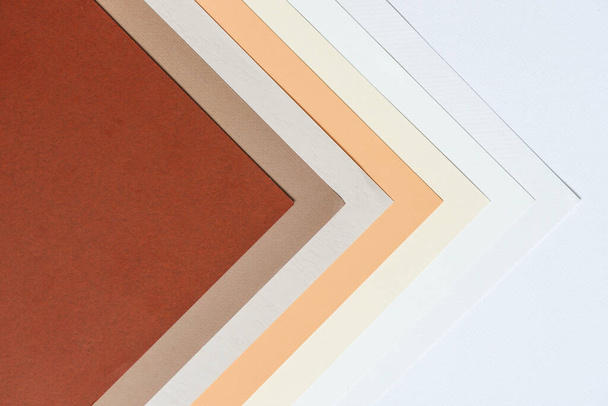 abstract background concept with pattern of earth tones colour paper, layers of blank brown paper and white, cream colour, beige colour background. - 写真・画像