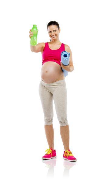 Pregnant woman holding mat - Φωτογραφία, εικόνα