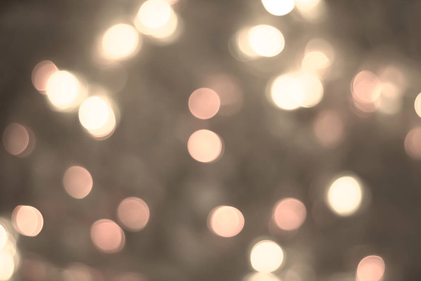 white glitter vintage lights background. white and yellow bokeh background. - 写真・画像