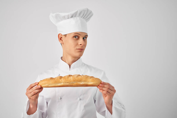 chef With loaf in hand professional work bakery - Zdjęcie, obraz