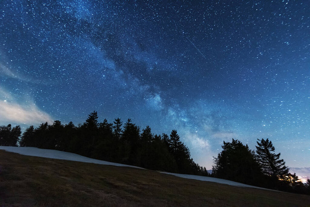 Bright starry sky with the milky way on the background of High Tatras mountains - Zdjęcie, obraz