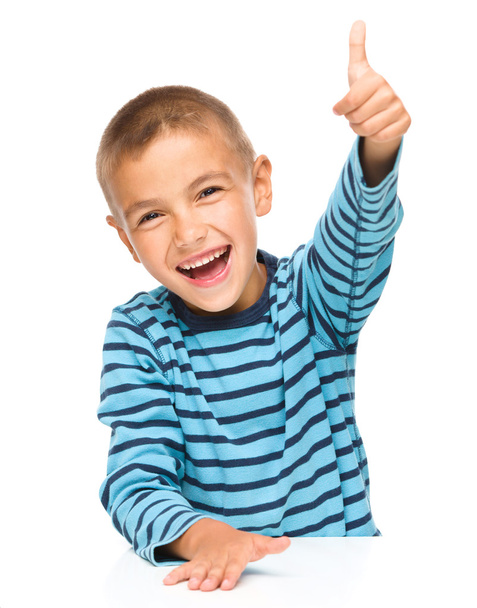 Little boy is showing thumb up sign - Фото, зображення