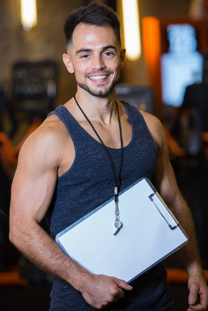 workout plan on clipboard in the gym - Photo, Image