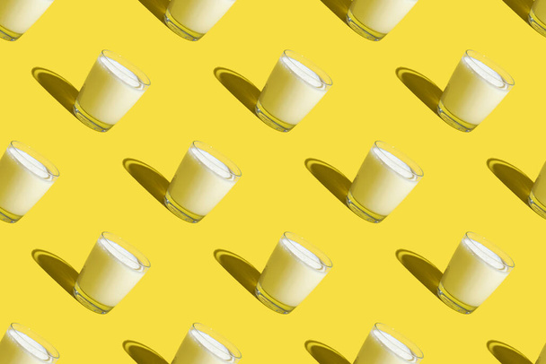World Milk Day. Pattern on a yellow background. A glass of milk. Sample. - Foto, Imagem