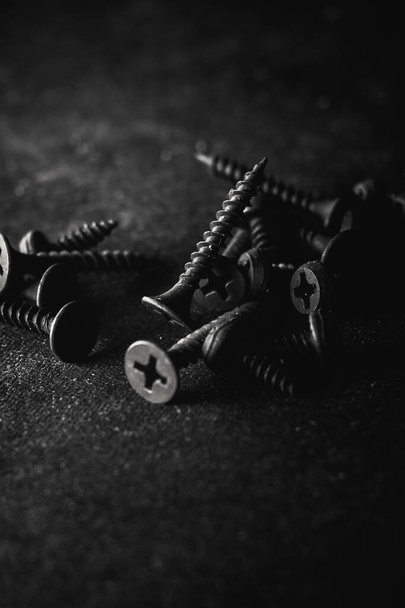 A pile of old metal bolts and screws - Fotó, kép