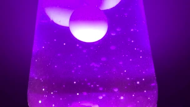 Lava lamp closeup 70s style purple lava lamp liquid background stock footage with copy space - Footage, Video