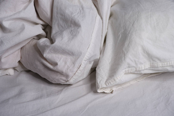 Bed linen texture. White bed linen background. Bed. Interior. - Φωτογραφία, εικόνα