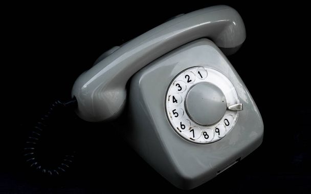 Rotary old telephone on black background - Photo, Image