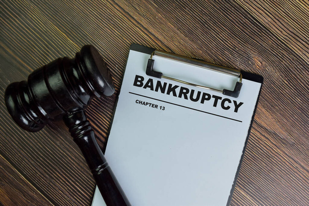 Bankruptcy - Chapter 13 write on a paperwork isolated on Wooden Table. - Фото, зображення