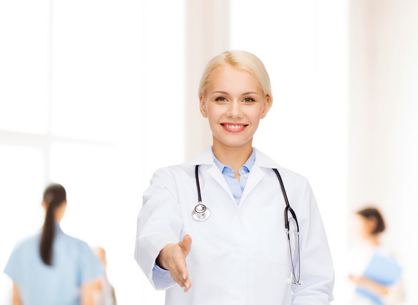 smiling female doctor with stethoscope - Zdjęcie, obraz