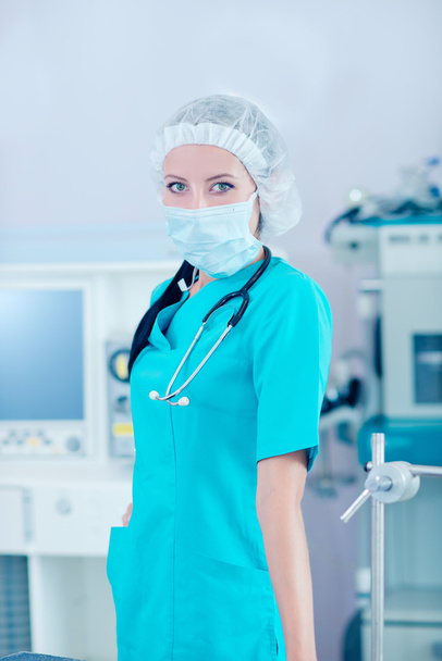 Young beautiful woman doctor in the operating room - Фото, изображение