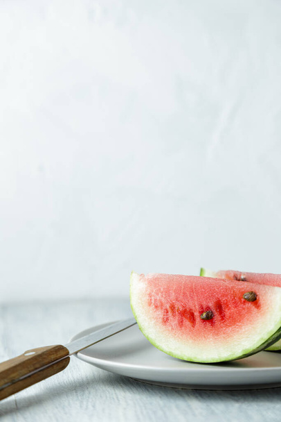 Sliced watermelon, honey watermelon on wooden table background. Very healthy, natural, vegetarian food. - Φωτογραφία, εικόνα