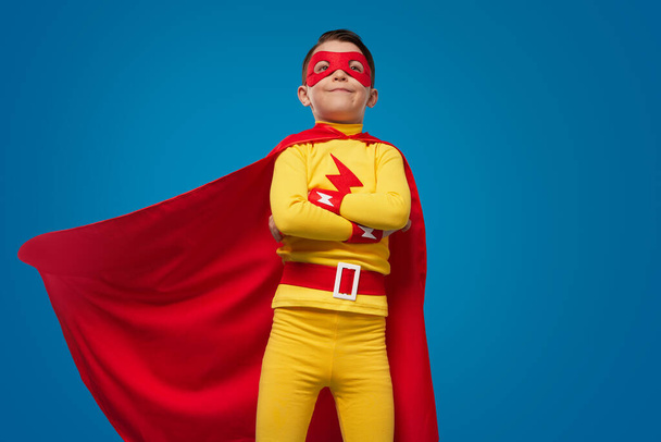 Confident superhero kid in costume and mask - Foto, Bild