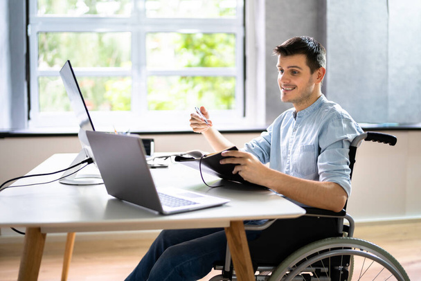 Disabled Virtual Assistant In Wheelchair Making Remote Video Call - Foto, Bild