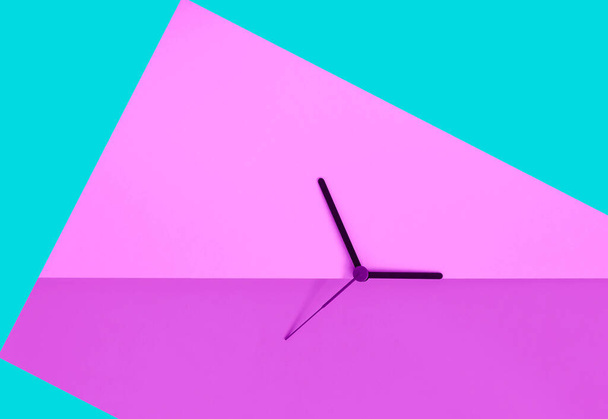 Daylight saving time concept. Clock hands on the monochrome blue color block background. Seasonal time change. Spring time change concept. Copy space.  - Photo, Image