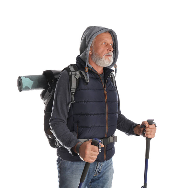 Male hiker with backpack and trekking poles on white background - Fotografie, Obrázek