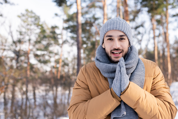 Happy man in warm clothes standing outdoors  - Fotografie, Obrázek