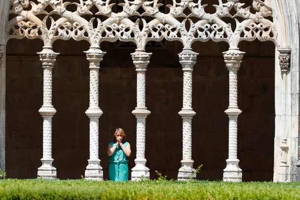 Batalha Monastery. The Royal Cloister was built between 1448 and 1477. Woman praying. Portugal.  - Photo, Image