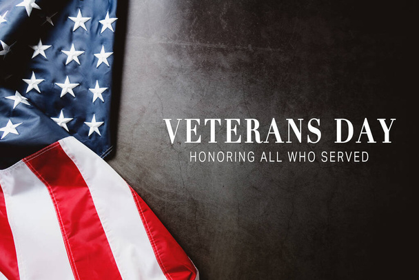 Veterans day. Honoring all who served. American flag on gray background with copy space. - Photo, image