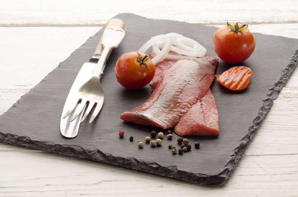 pink herring with vegetable on slate - Photo, Image