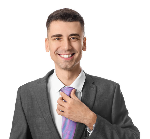 Handsome young man in stylish formal suit on white background - Photo, Image