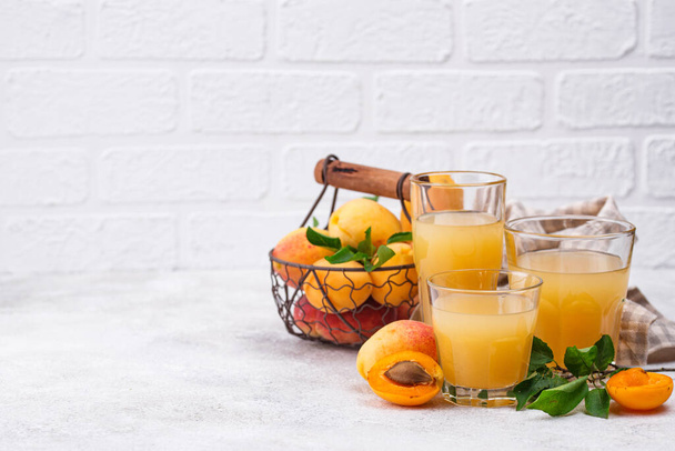Apricot juice in glass. Healthy drink - 写真・画像