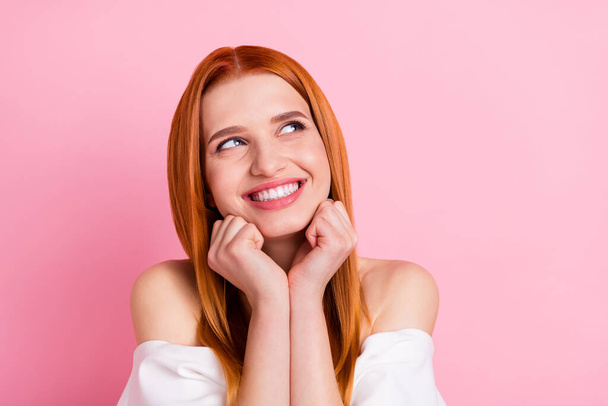 Portrait of attractive girlish dreamy cheerful red-haired girl making conclusion copy space isolated over pink pastel color background - Photo, Image