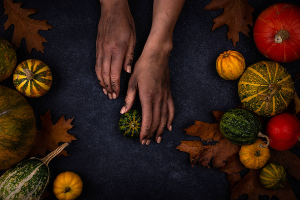 Halloween autumn background with witch hand - Photo, Image