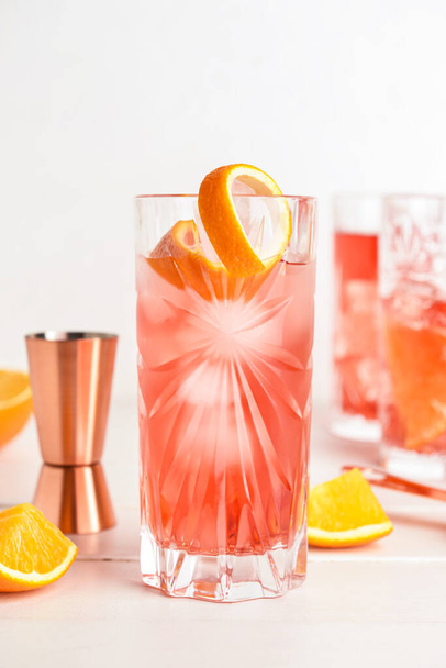 Glasses of tasty Negroni cocktail on light background - Photo, Image