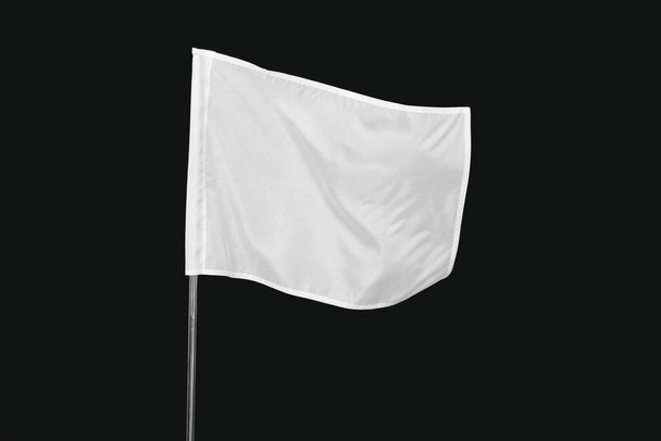 White flag on dark background - Foto, Imagen