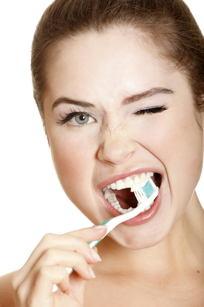 Young lady brushing her teeth - Foto, immagini