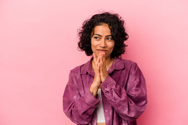 Young curly latin woman isolated on pink background making up plan in mind, setting up an idea. - Photo, Image