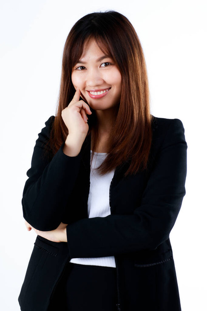 Very young teen businesswoman in formal black suit smile with cute and self-confident starting working life in modern office. Concept for newly graduated students and the first day of job career - Photo, Image
