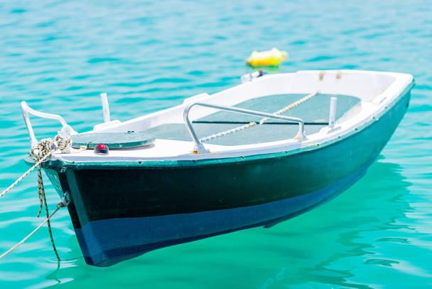 boats sway on the turquoise waves of the Ionian sea of Greece in sunny weather - Photo, Image