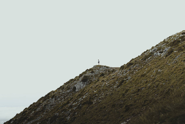 A person alone on a mountain - 写真・画像