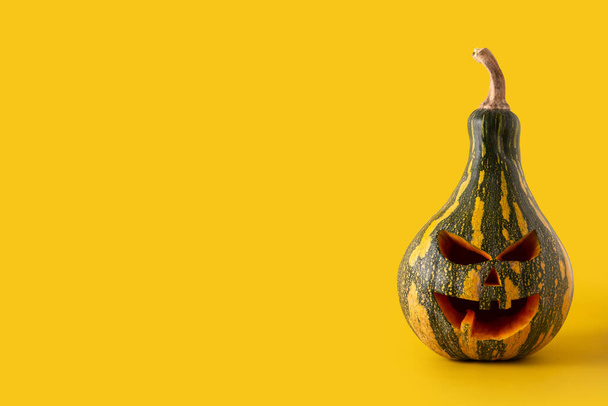 Halloween green pumpkin on yellow background - Photo, Image