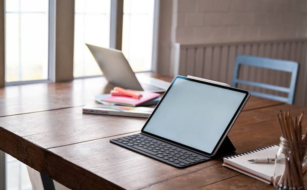 Mockup Digital tablet blank screen and office equipment on wooden table. - Fotografie, Obrázek