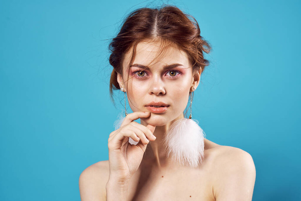 cheerful woman bare shoulders fluffy earrings charm fashion close-up - Foto, afbeelding