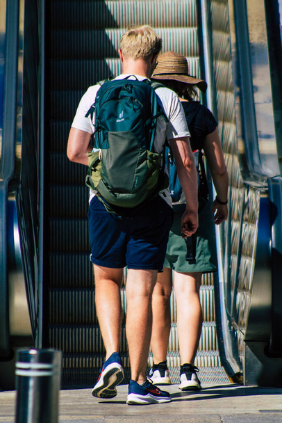 Seville Spain September 18, 2021 Pedestrians using an escalator during the coronavirus outbreak hitting Spain, wearing a mask is not mandatory but most of people wear it - Valokuva, kuva