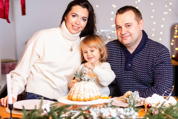 Happy family with children rolling dough in Christmas kitchen. holidays, new year and christmas concept. Happy family - Zdjęcie, obraz