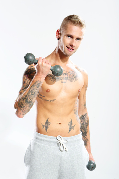 Dumbbell. Man with weights trained muscles - Photo, Image