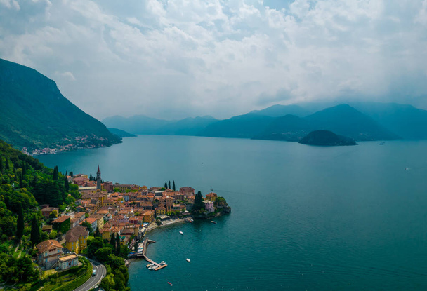 Aerial view of Varenna village on a coast of Como lake, Italy on a cloudy day - Fotoğraf, Görsel