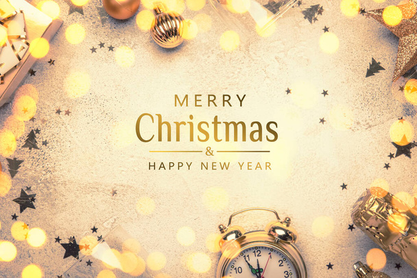 Merry Christmas and Happy New Year background with text. Frame with gold Christmas decorations, stars, snowflakes, balls, alarm clock, gift box and champagne bottle, top view - Zdjęcie, obraz