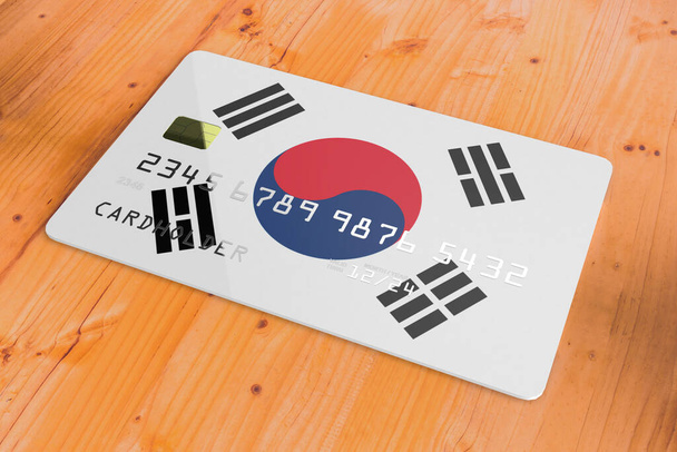 Plástico de crédito ou cartão de débito bancário com bandeira do país da Coreia do Sul sistema bancário nacional isolado na mesa de madeira close up conceito de imagem de renderização 3d - Foto, Imagem