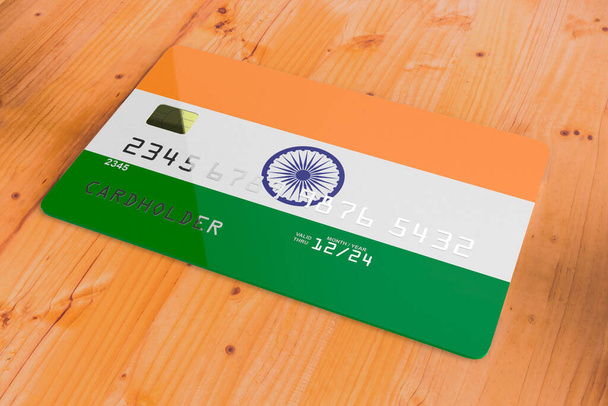 Plástico de crédito ou cartão de débito bancário com bandeira do país da Índia sistema bancário nacional isolado na mesa de madeira close up conceito 3d imagem de renderização - Foto, Imagem
