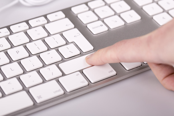 silver keyboard with woman finger - Photo, Image