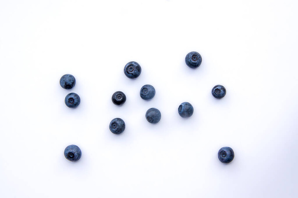 Flat lay composition with juicy, fresh, healthy blueberry fruits  - Photo, Image