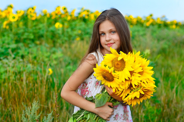 little glad girl with yellow on green a meadow, emotions, lifestyle - Photo, image