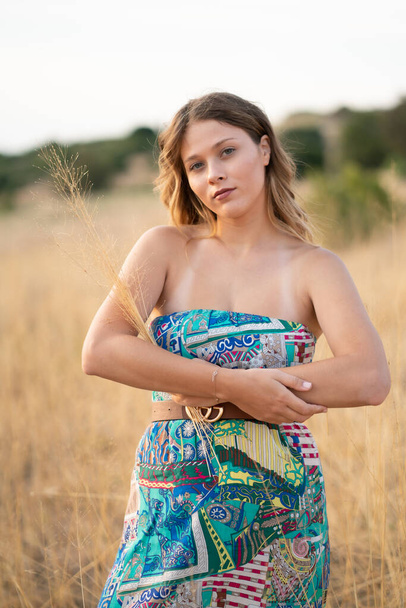 Natural Looking Young Beautiful Woman with Hazel eyes posing in the fields, no post editing  - Foto, Bild