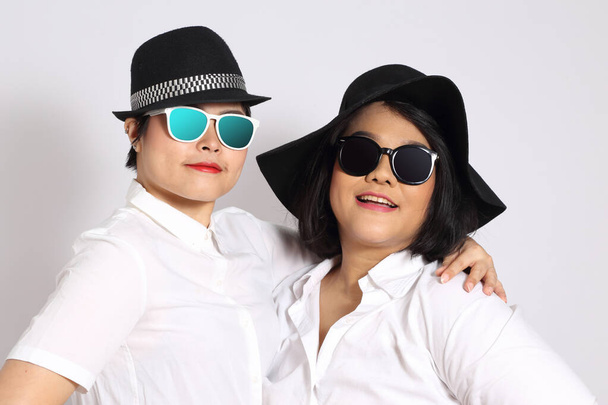 Two Asian women on the white background. - Photo, Image